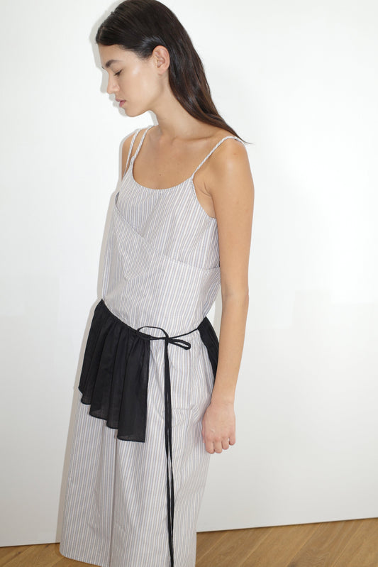 female model wears the double layer dress by Deiji Studios in seas stripe worn here with the peplum belt black
a mid-length dress featuring adjustable underlayer straps with sliders for a customised fit and a tied overlayer strap detail at the shoulder.
made from 100% organic cotton poplin