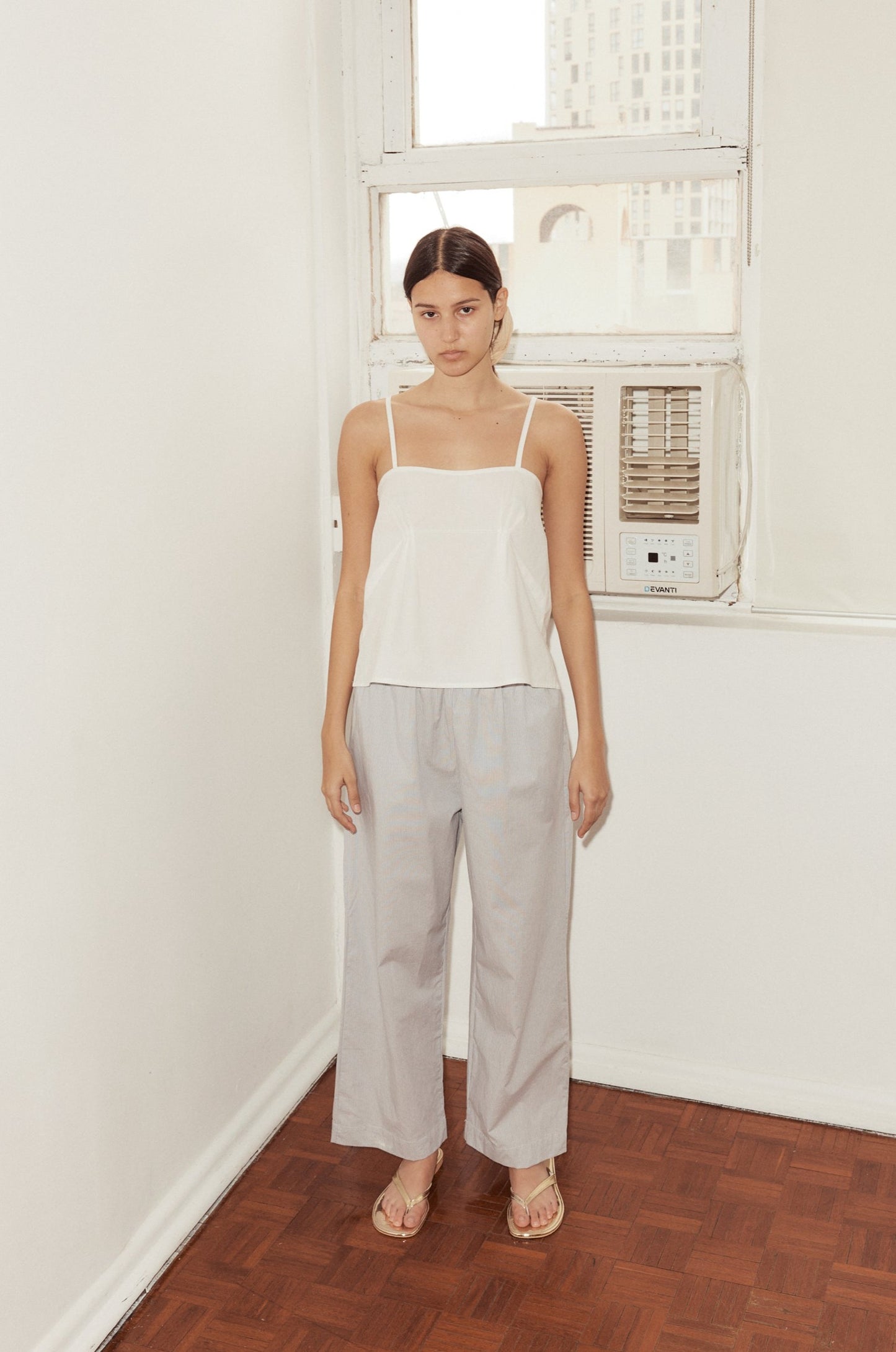 Female model wearing Ease Trouser - Dream Stripe by Deiji Studios against plain background
