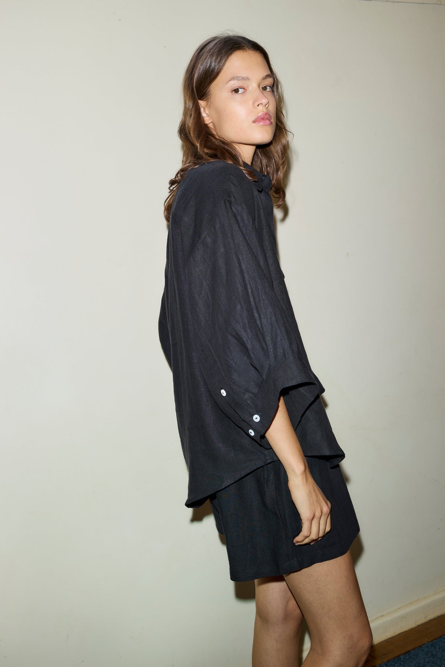 Female model wearing the 03 set - deep black by Deiji Studios against plain background