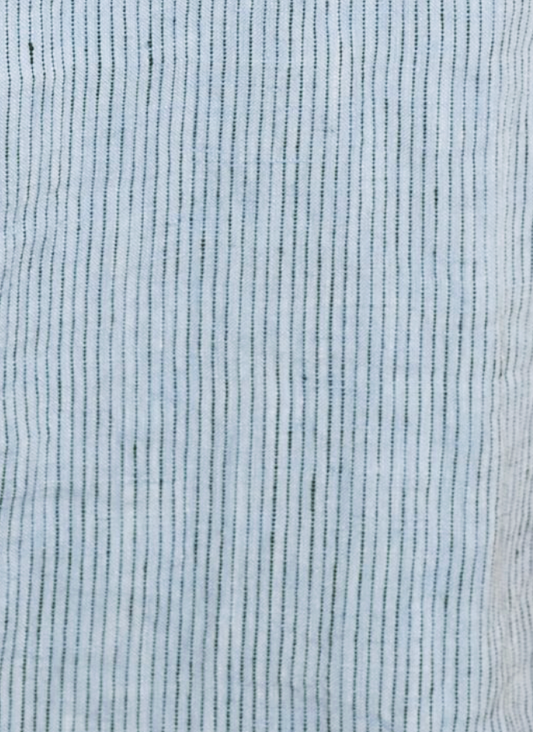 Close-up of Sheets - Blue Stripe reveals light blue fabric with thin, evenly spaced vertical black stripes, creating a simple, textured design inspired by classic linen sheets.
