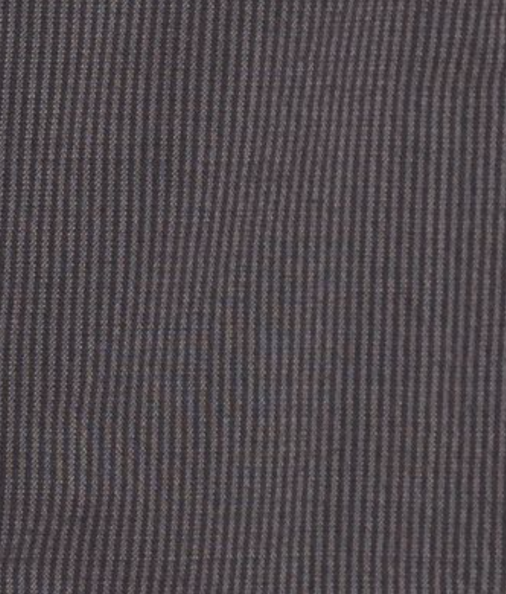 Close-up of brown stripe corduroy fabric with fine, vertical ridges and a slightly uneven surface, as featured in Deiji Studios' Lapel Jacket - Brown Stripe crafted from organic cotton.