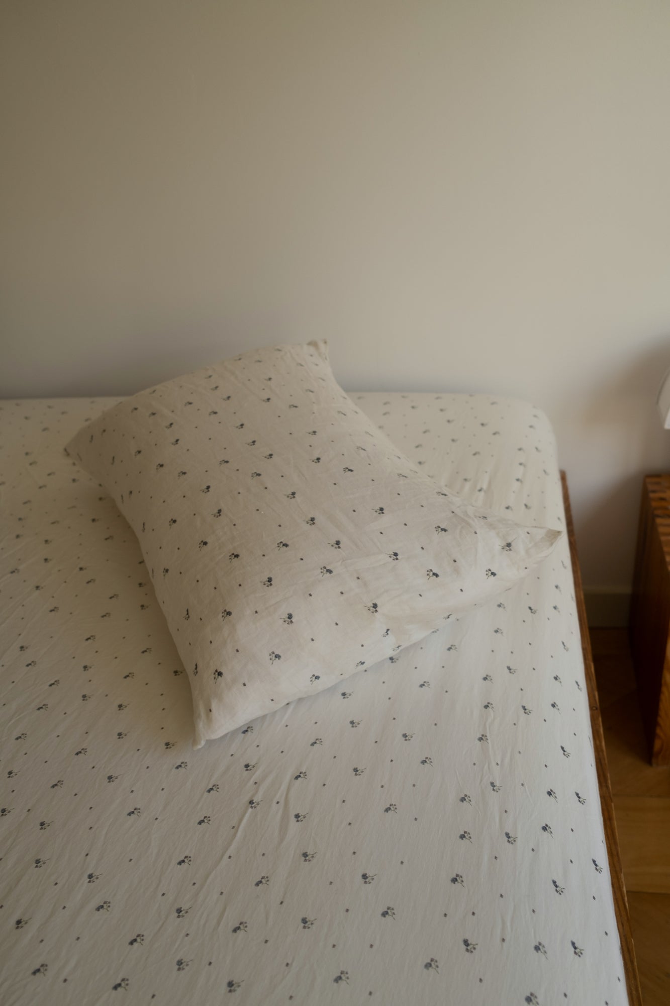 Light room with queen bed topped with Sheets - vintage floral by Deiji Studios