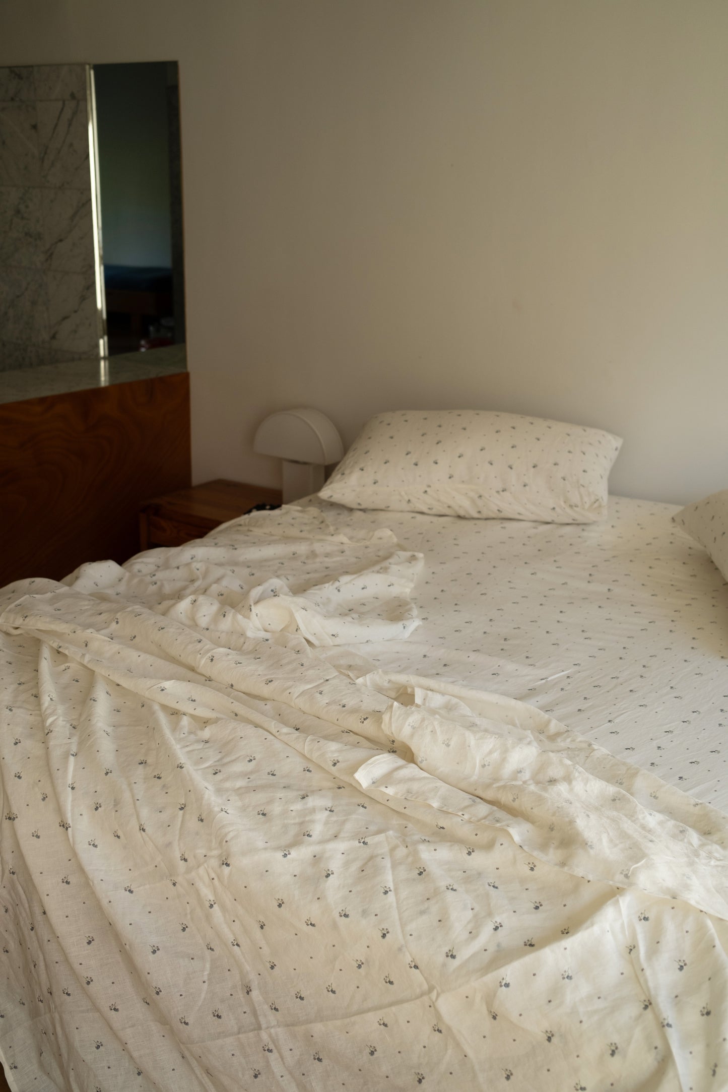 Light room with queen bed topped with Sheets - vintage floral by Deiji Studios