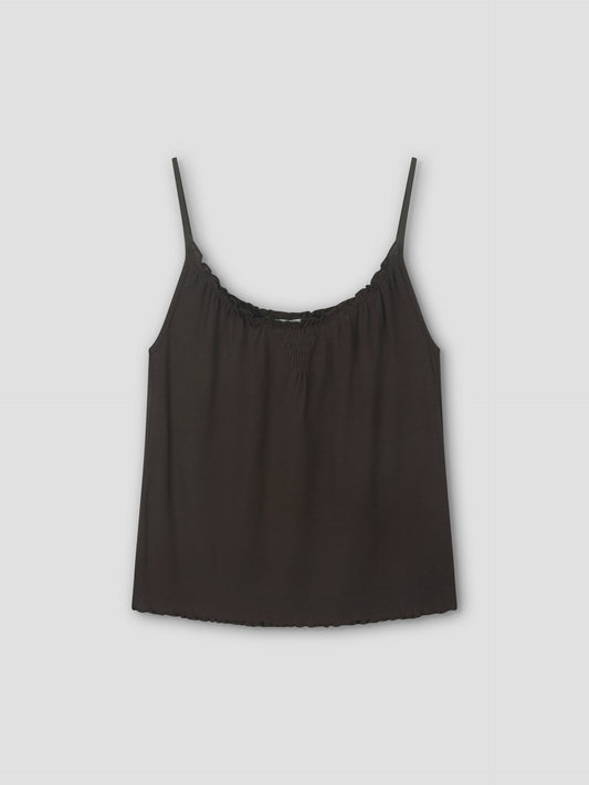 The Cotton Flounce Tank in brown is a sleeveless camisole with thin straps and a gathered neckline, fitted to the body and shown against a plain light gray background.