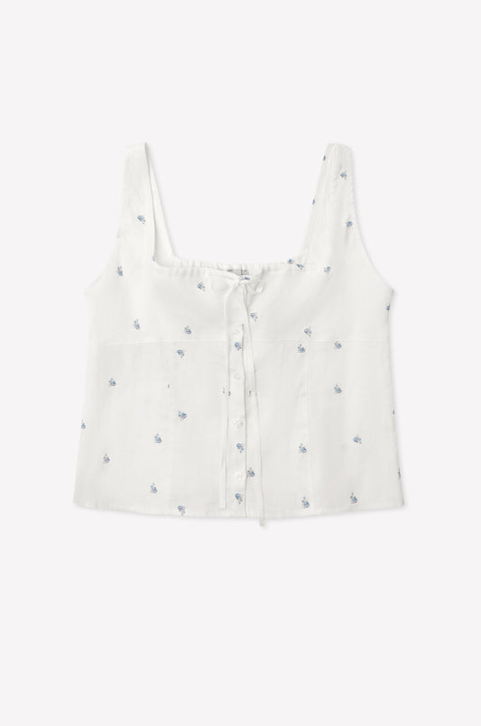The Relax Short Set - Floral Blue features a white sleeveless crop top with a square neckline, blue floral prints, front buttons, and a drawstring chest detail—shown laid flat on a plain white background.
