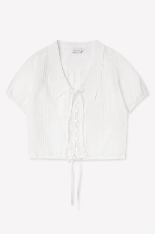The Fine Collar Top - White features a collared v-neck, short sleeves, button-down front, pintuck details, and a waist tie—crafted from cotton poplin with signature Deiji Studios elegance.