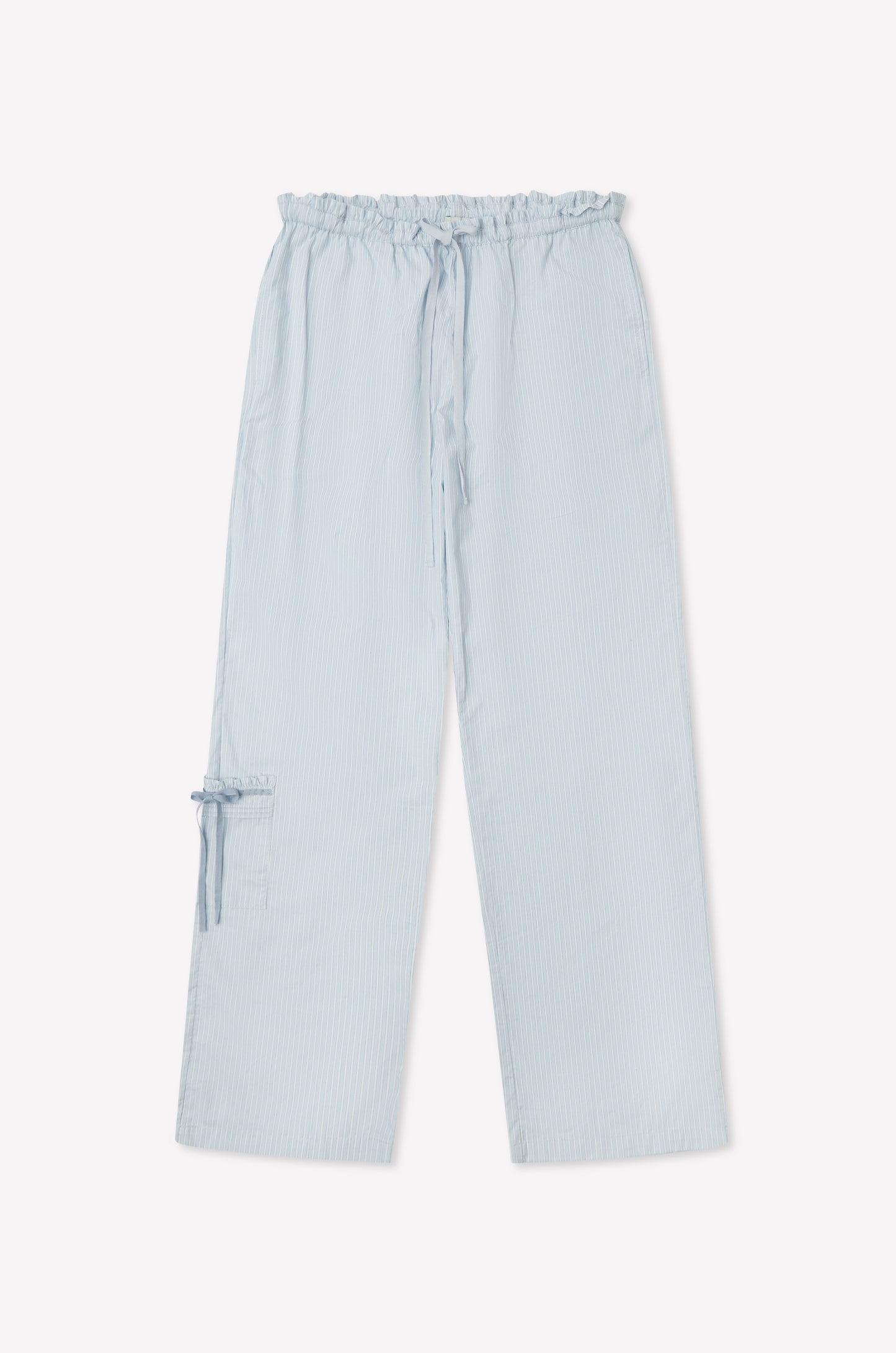 The Grosgrain Pant - Mist Stripe features a relaxed leg, elastic waistband with drawstring, and a patch pocket with bow detail. Crafted from subtly textured fabric in light blue stripes, these pants are showcased on a plain white background.