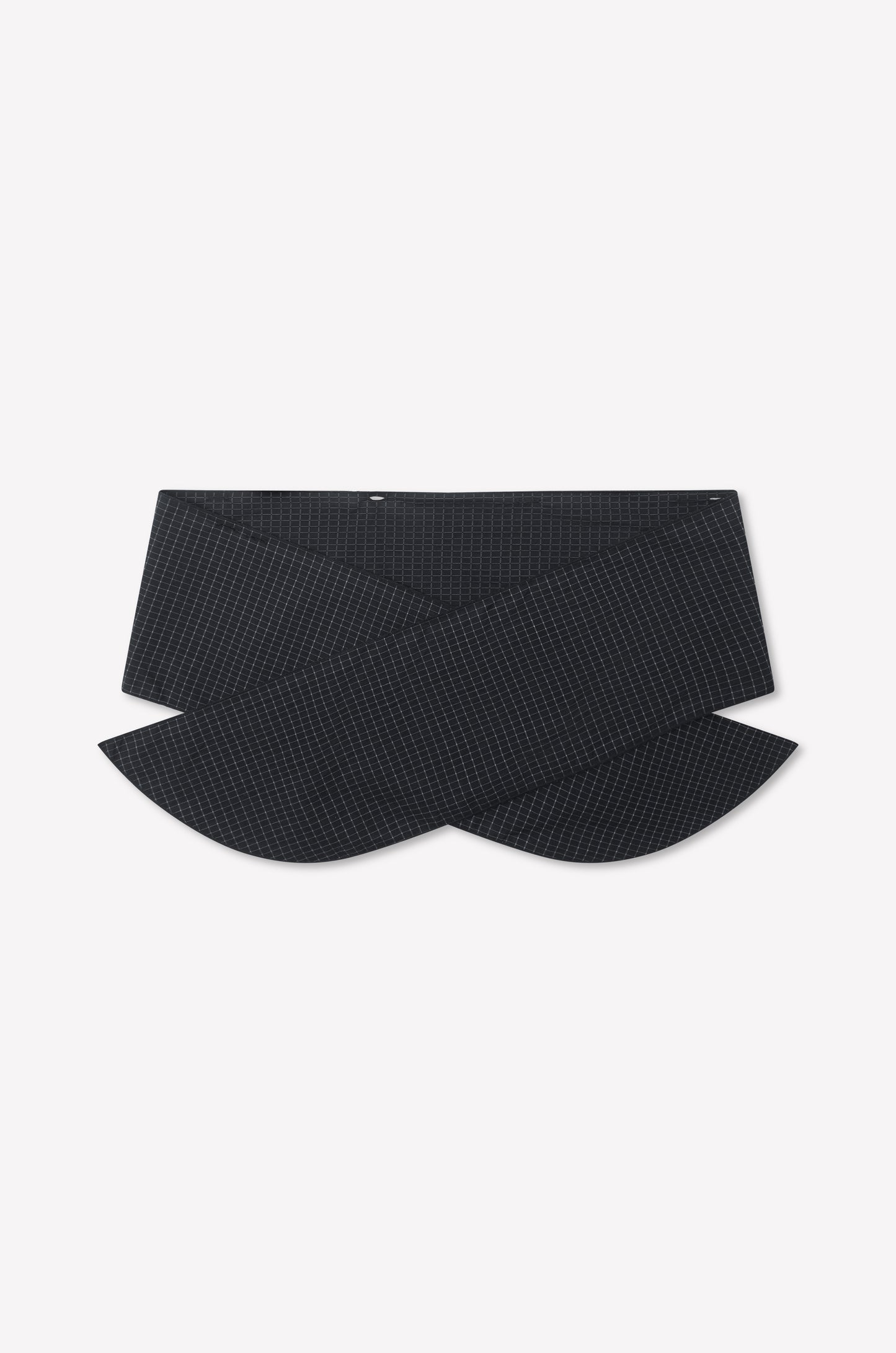 The Flow Top - Mono Grid from Deiji Studios features a black, textured fabric belt with a subtle crisscross grid pattern and wide, rounded overlapping ends, shown on a plain white background.