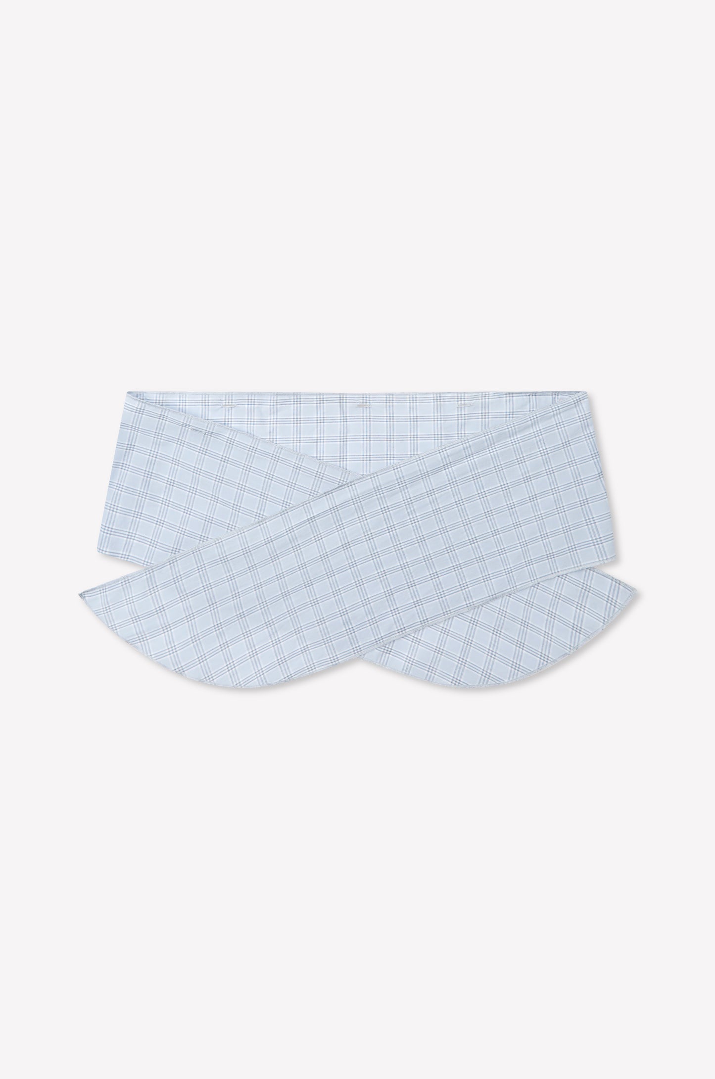 The Flow Top - Powder Check features a light blue and white plaid fabric, showcasing a unique overlapping and curved collar inspired by Deiji Studios, displayed on a plain white background. Includes a removable scarf panel for versatile styling.