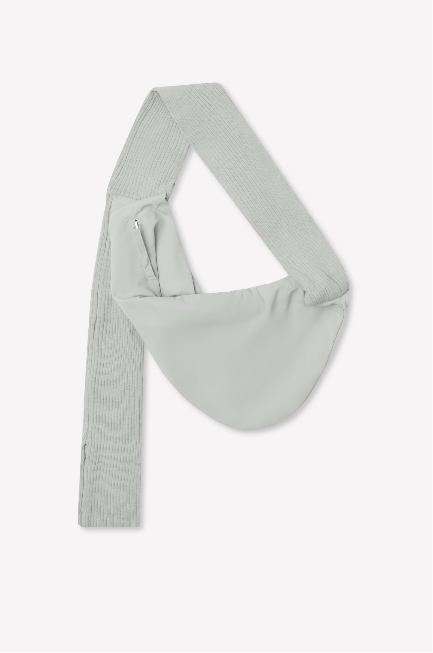 A baby blue asymmetrical sling saddle bag, named Knit Strap Bag, features a wide, ribbed knit shoulder strap and a side zipper, displayed against a plain white background.