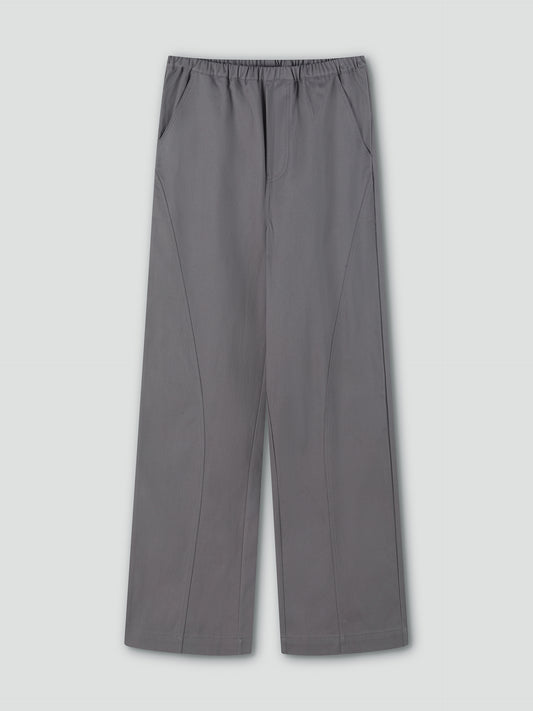 Curve Pant - Lavendar Smoke by Deiji Studios: wide-leg, relaxed fit trousers in lavender grey with curved seams, elastic waistband, and side pockets. Shown flat on a light grey background.