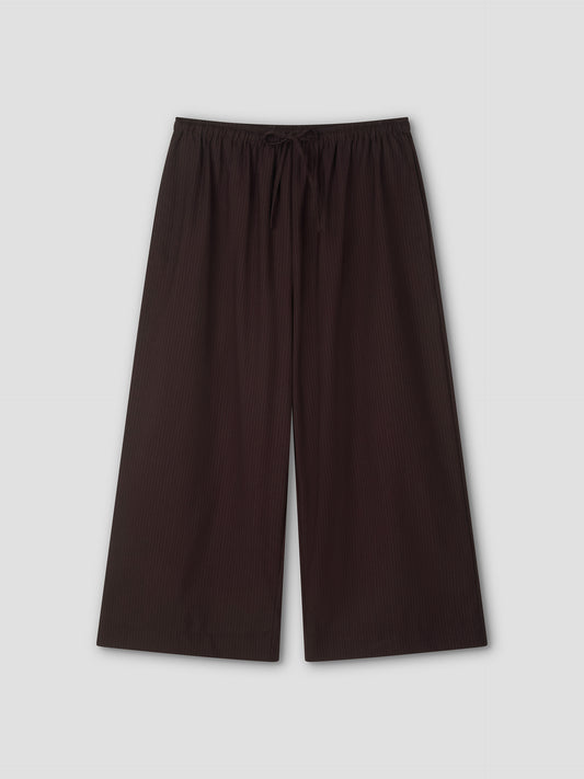 Wide-leg, ankle-length Drawcord Culotte in Burgundy Brown Stripe with subtle vertical pinstripes and elasticated waistband, laid flat on a light gray background. Inspired by the relaxed yet refined style of Deiji Studios.