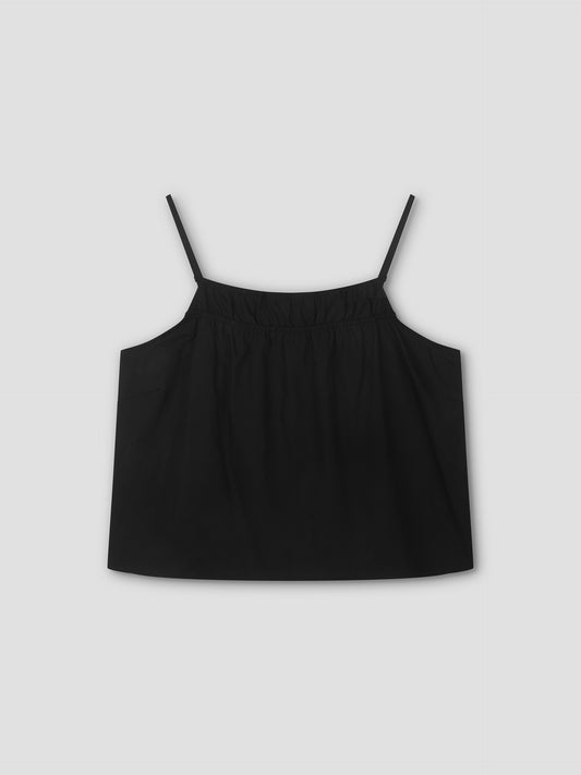 The Double Layer Top - Black by Deiji Studios features thin spaghetti straps and a gathered neckline in a relaxed fit, shown against a plain light gray background.