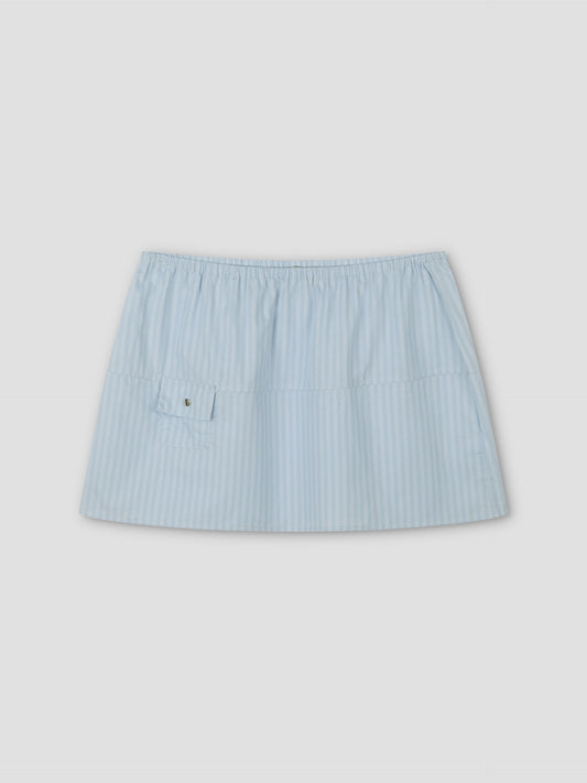Pocket Skirt - Lake Blue Stripe: a light blue and white striped mini skirt with an elastic waistband and small front pocket, shown on a plain light gray background.