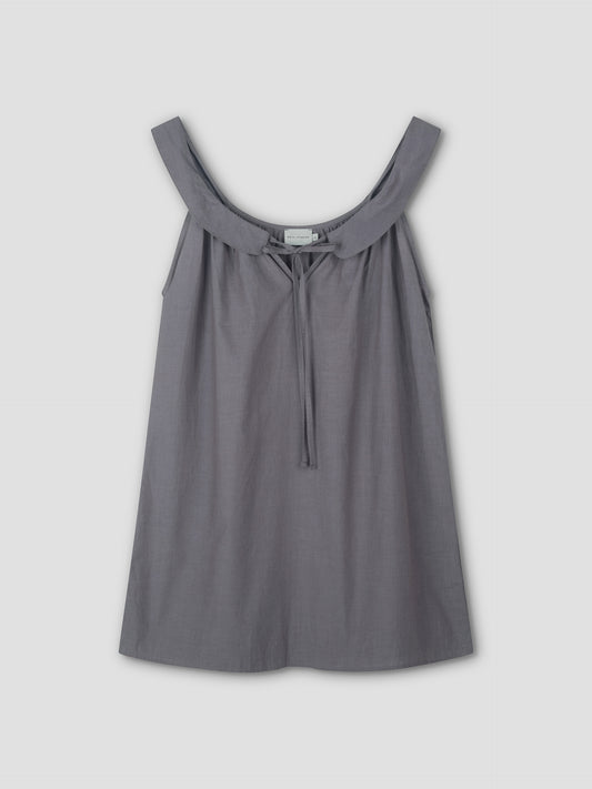 The Rounded Neck Dress - Currant features a sleeveless design with a wide, scooped neckline and front tie detail, shown against a plain light background.