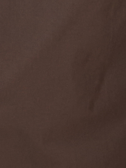 The Tab Pant - Dark Brown features a solid brown textured surface with subtle, uneven shading reminiscent of organic cotton fabric—perfect for creating a stylish wide leg or tab pant look.