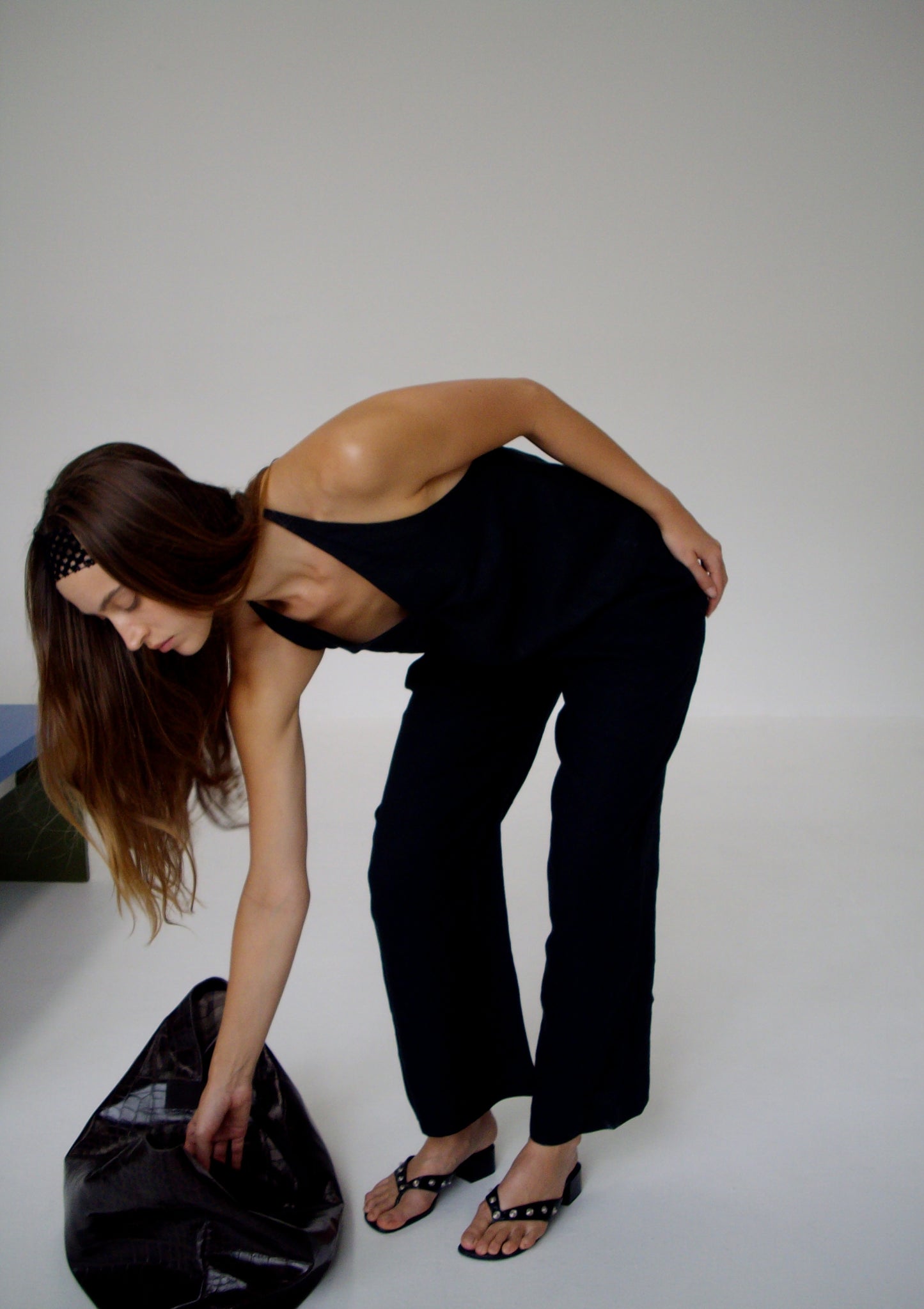 female model wears the linen ease trouser by Deiji Studios in black
the ankle length pant features a soft minimal elastic waist with side seam pockets in a straight leg
can be worn at home, in bed, or out
made from 100% GOTS certified organic, OEKO-TEX 100 certified and EU certified stone washed french linen
paired with a black linen halter top