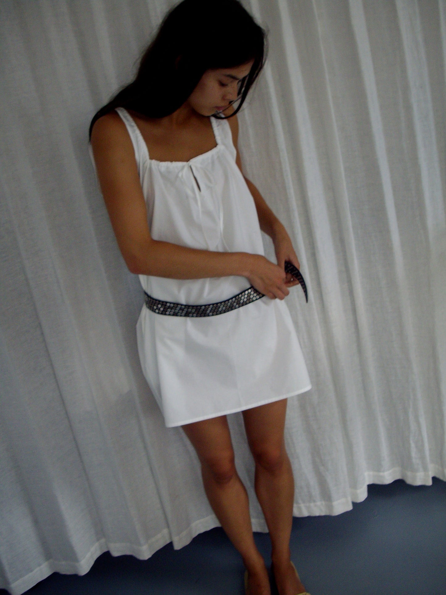 female model wears the bow dress in white exclusive to Deiji Studios
a crisp and lightweight mini-length dress features a flattering gathered square neckline with keyhole and tie front feature and side seam pockets
made from 100% GOTS certified organic cotton poplin