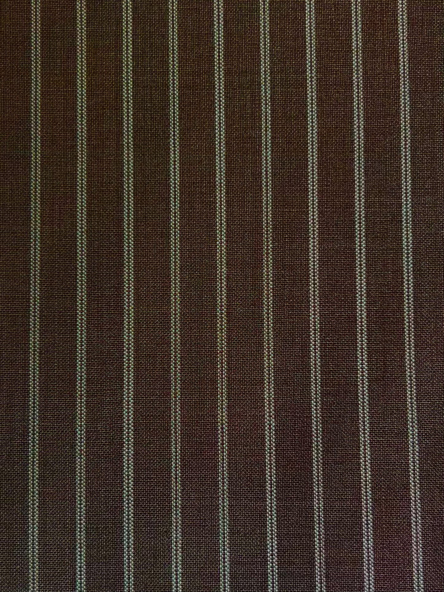Pure Wool Ease Trouser - Sable Stripe features dark brown fabric with thin, evenly spaced vertical white pinstripes—perfect for relaxed or tailored looks. The stripes run parallel across the whole surface.