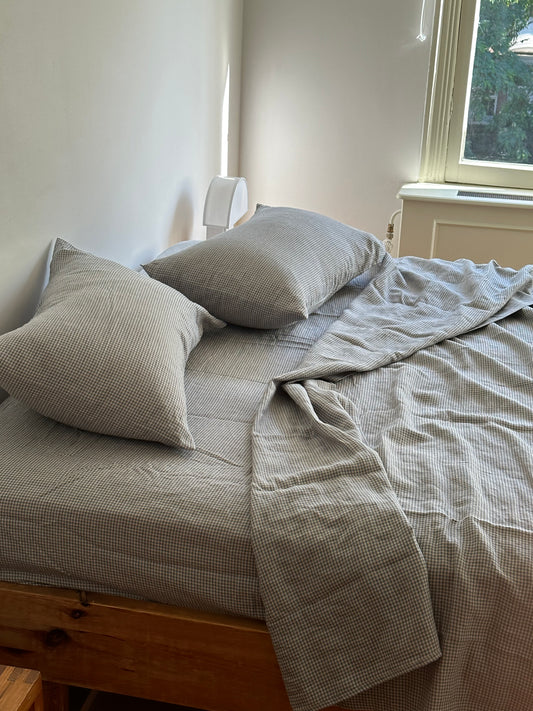 Light room with queen bed topped with Sheets - field check by Deiji Studios