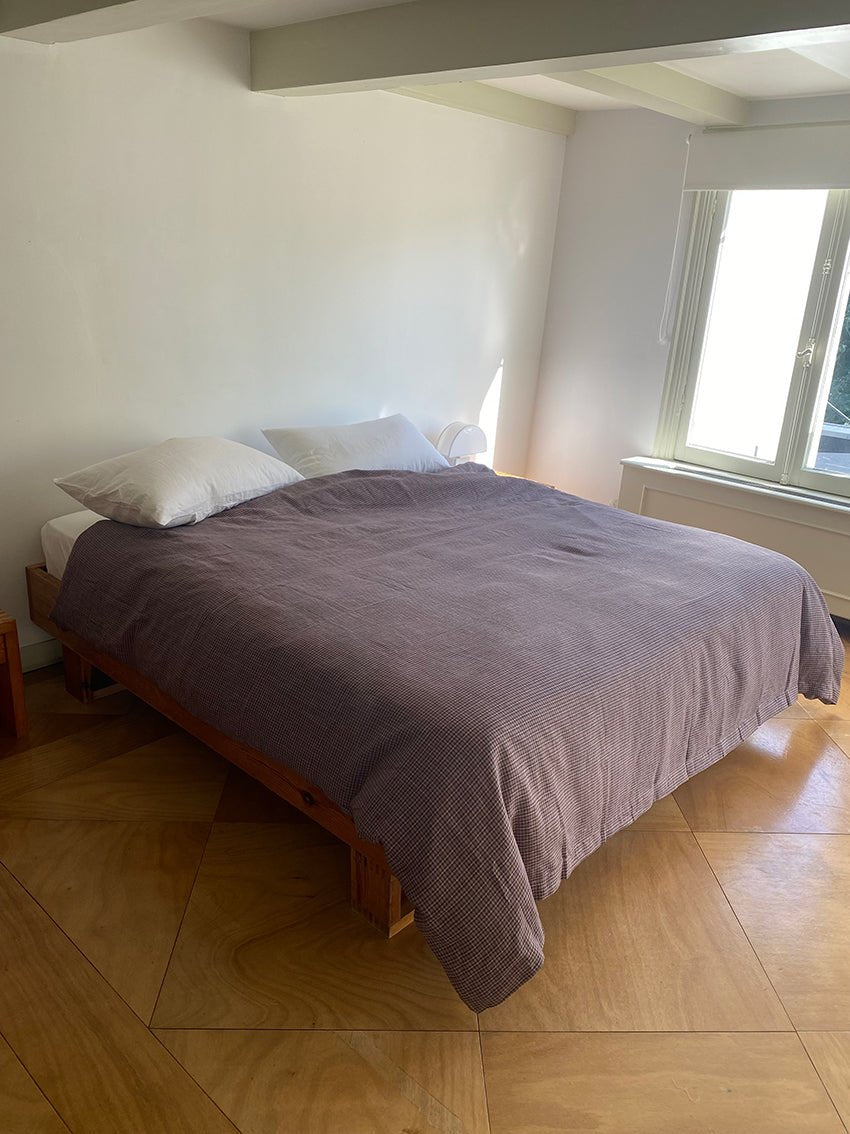Light room with queen bed topped with Duvet cover - russet check by Deiji Studios