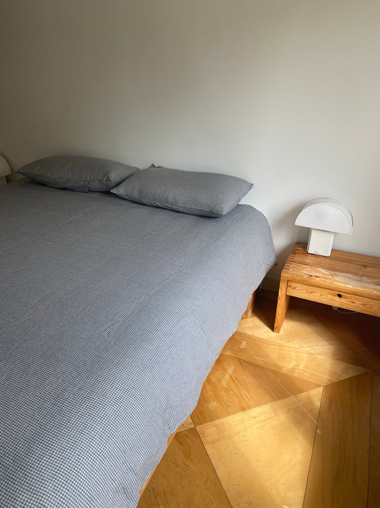 Light room with queen bed topped with Duvet cover - field check by Deiji Studios