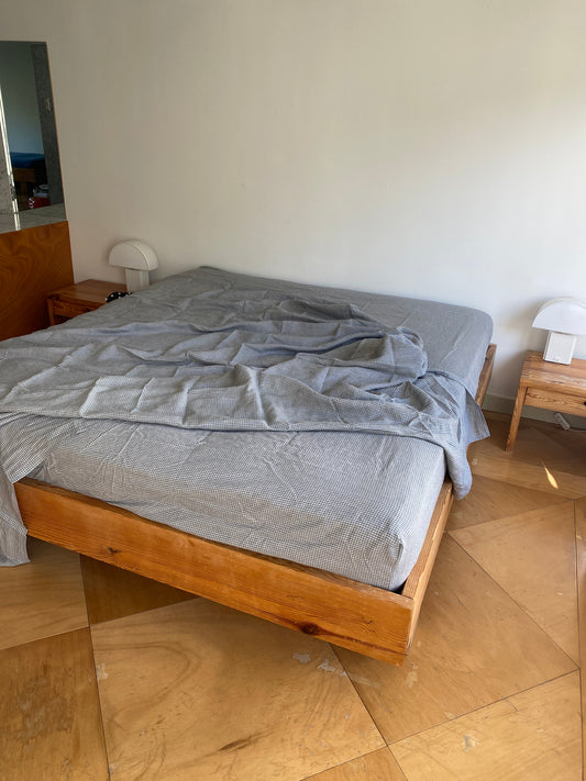 Light room with queen bed topped with Sheets - field check by Deiji Studios