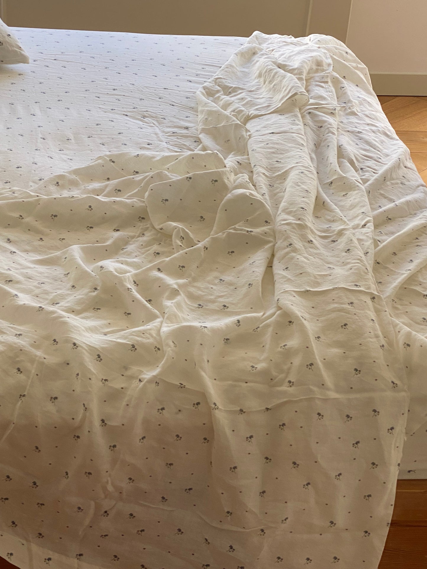 Light room with queen bed topped with Sheets - vintage floral by Deiji Studios