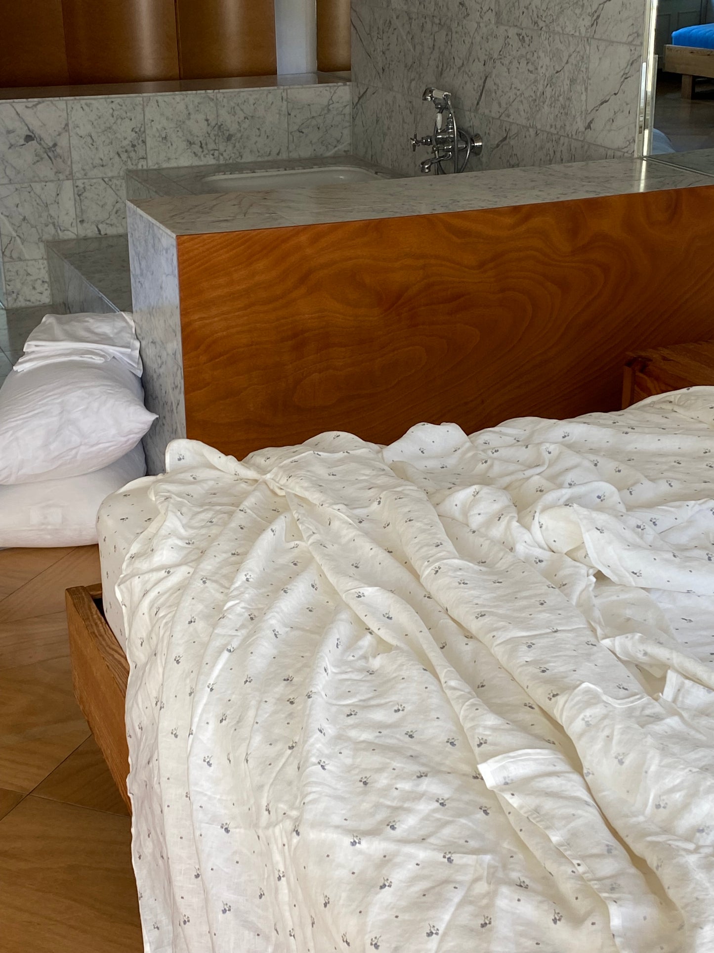 Light room with queen bed topped with Sheets - vintage floral by Deiji Studios