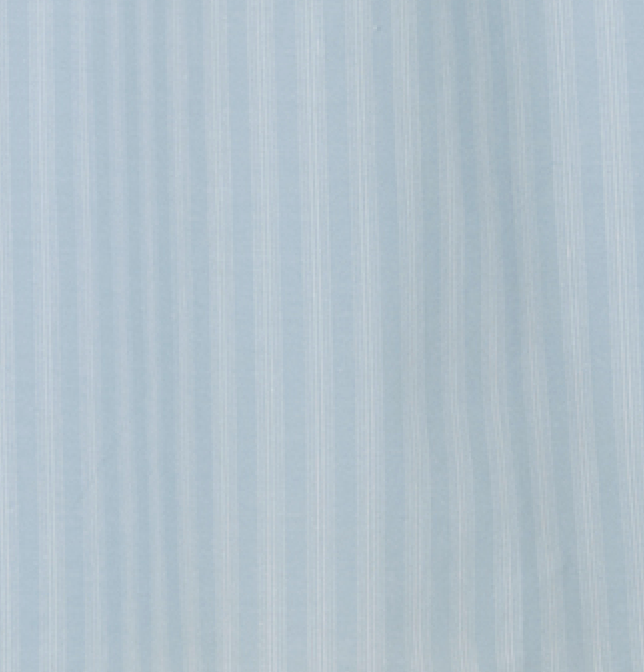 The Belted Skirt - Powder Blue Stripe features light blue fabric with subtle vertical white stripes, a smooth weave, and an understated pattern for effortless style.