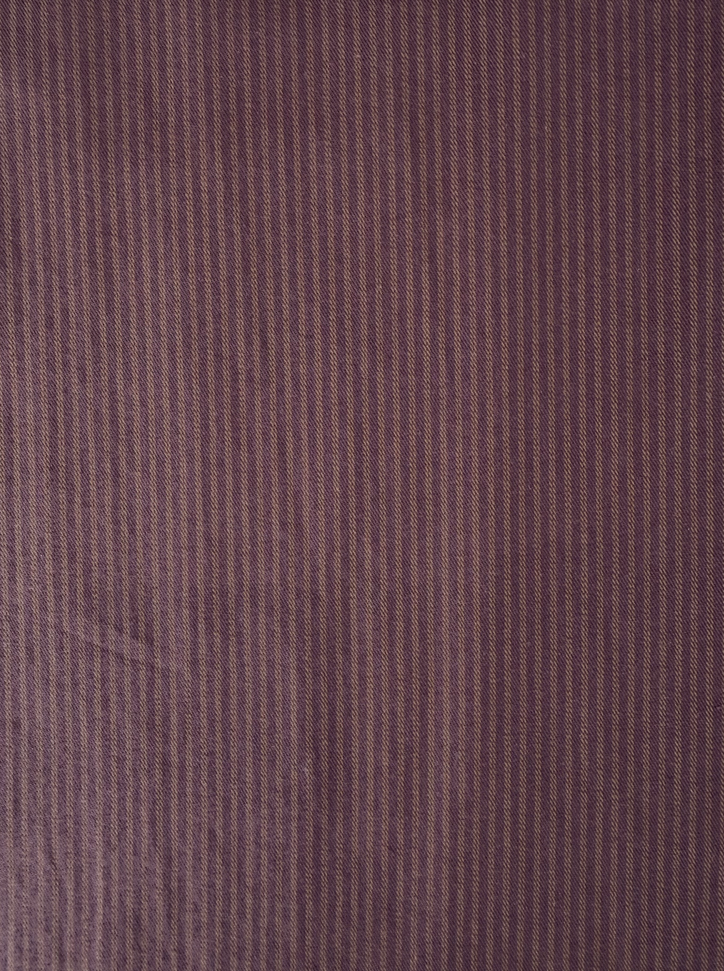 Close-up of the Loop Pant - Mulberry Stripe fabric, featuring thin vertical brown and purple mulberry stripes that create a subtle, textured pattern—ideal for crafting a relaxed straight leg or loop pant.