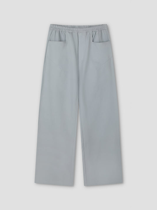 Square Pocket Pant - Blue: Relaxed blue pant with an elastic waistband, two square front pockets, and a wide, straight leg silhouette, shown flat on a plain background.