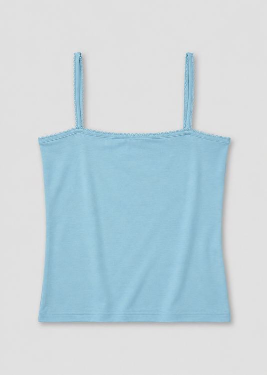 The Scallop Tank - Sky by Deiji Studios laid flat against a plain white background, a fitted ribbed tank in sky blue with fine shoulder straps and scallop trim along the straight neckline and straps.