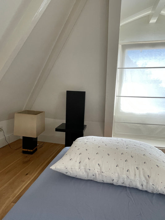 Light room with queen bed topped with Sheets - Cornflower by Deiji Studios