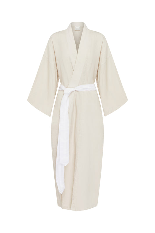 The 02 robe - oatmeal: a knee-length beige linen robe with wide sleeves and a white waist belt, inspired by Deiji Studios and shown on a plain white background.