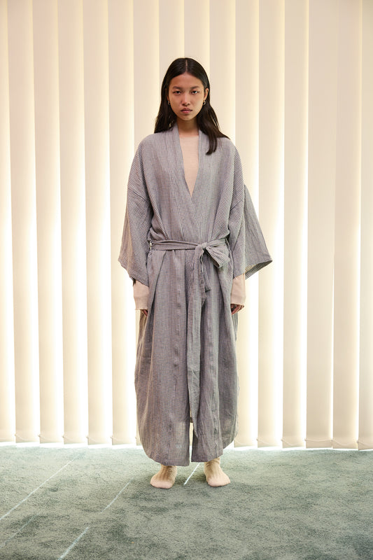 Female model wearing The 02 Robe - Field Check by Deiji Studios against plain background