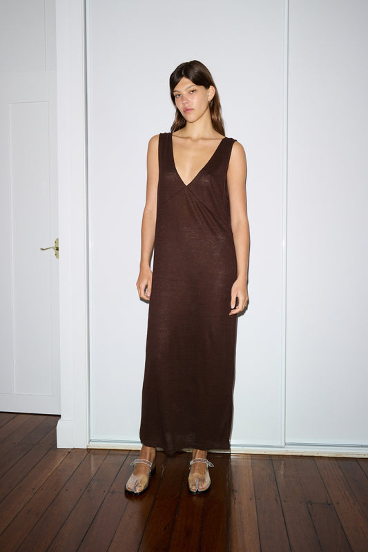 Female model wearing the soft tank dress - chocolate by Deiji Studios against plain background