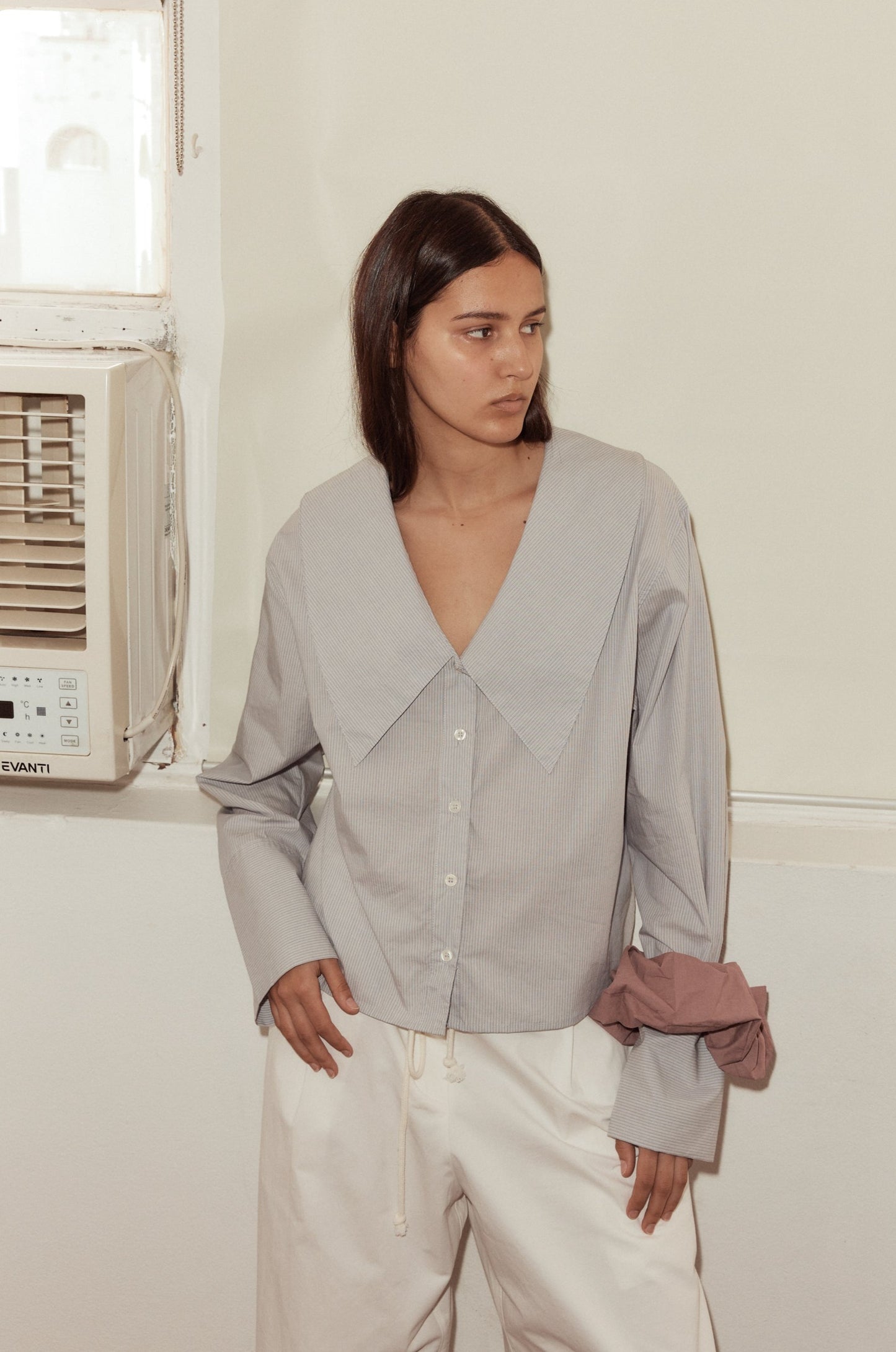 Female model wearing Oversized Collared Shirt - Dream Stripe by Deiji Studios against plain background