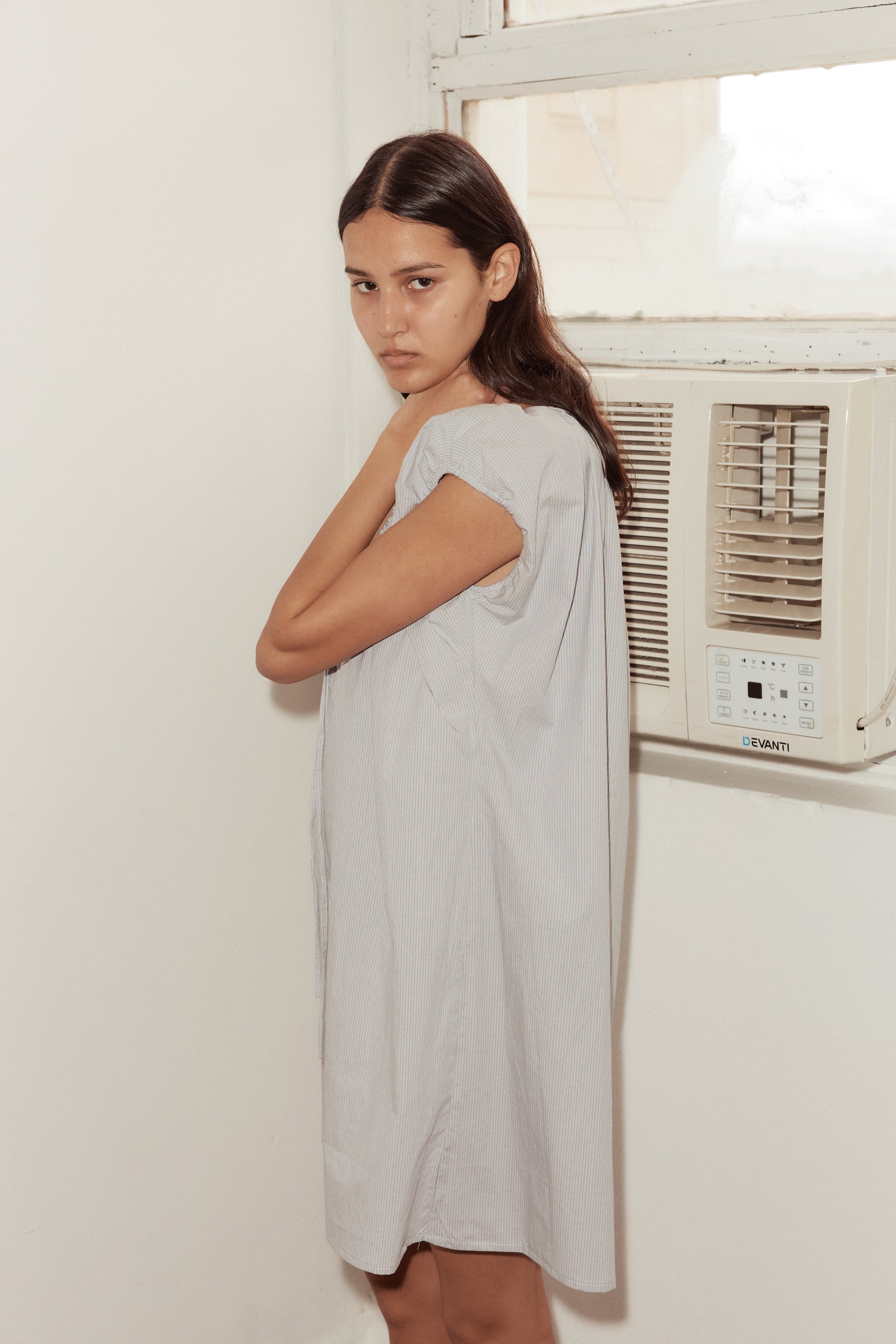 Female model wearing Capped Sleeve Dress - Dream Stripe by Deiji Studios against plain background