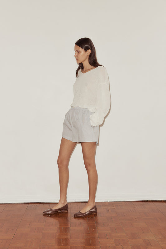 Female model wearing The Boxer - Dream Stripe by Deiji Studios against plain background