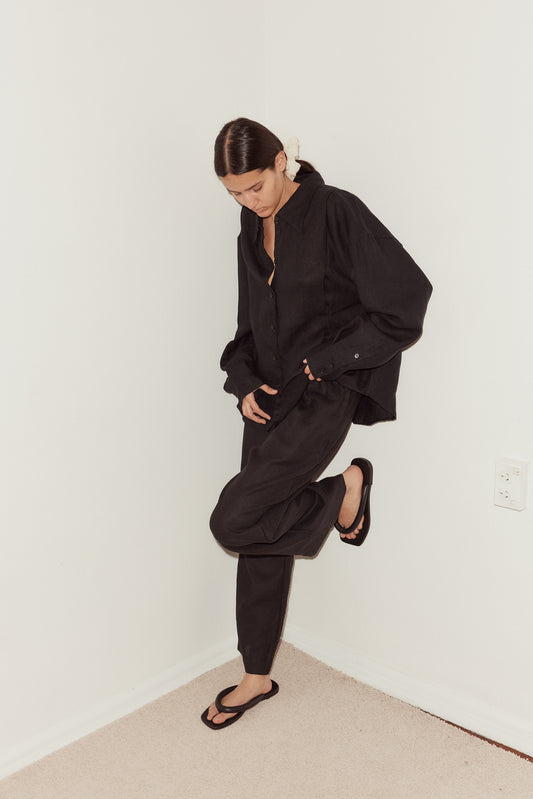 Female model wearing Tack Set - Black by Deiji Studios against plain background
