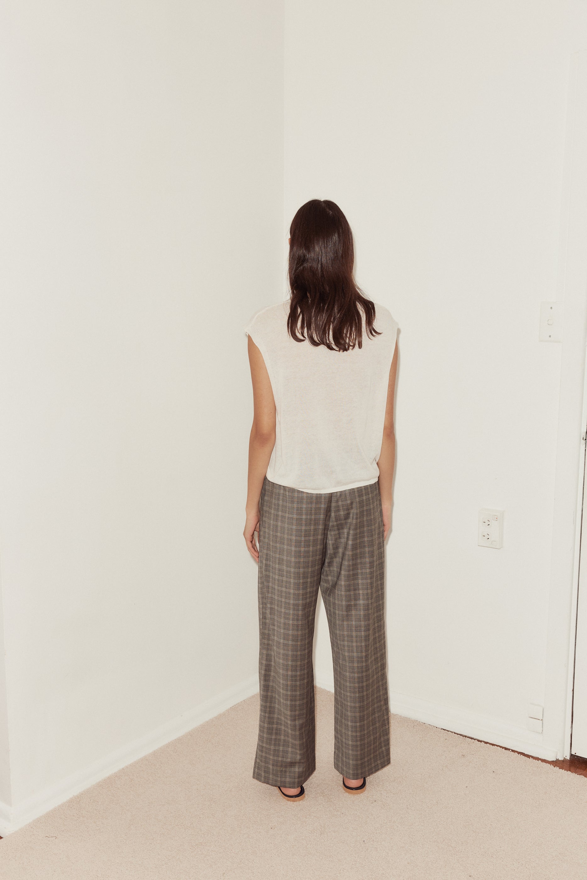 Female model wearing Tailored Pants - Everyday Check by Deiji Studios against plain background