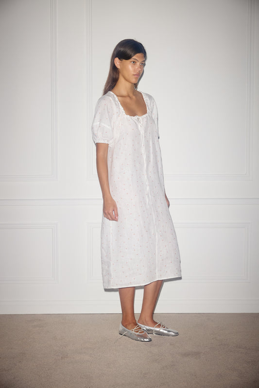 Female model wearing Curved Seam Midi Dress - Corsage Print by Deiji Studios against plain background