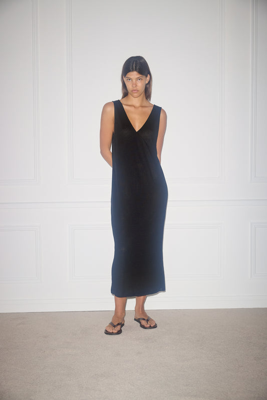 Female model wearing soft tank dress - black by Deiji Studios against plain background