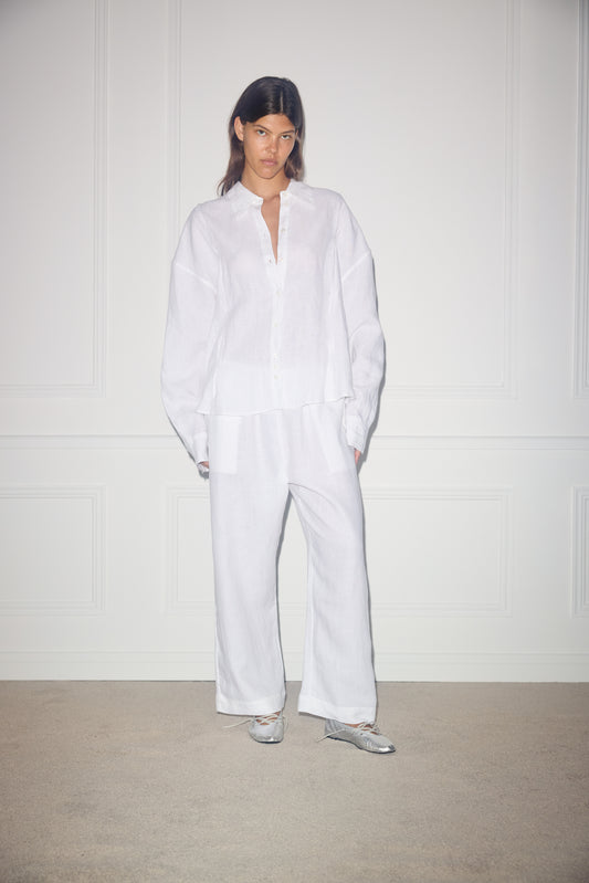 Female model wearing Tack Set - white by Deiji Studios against plain background