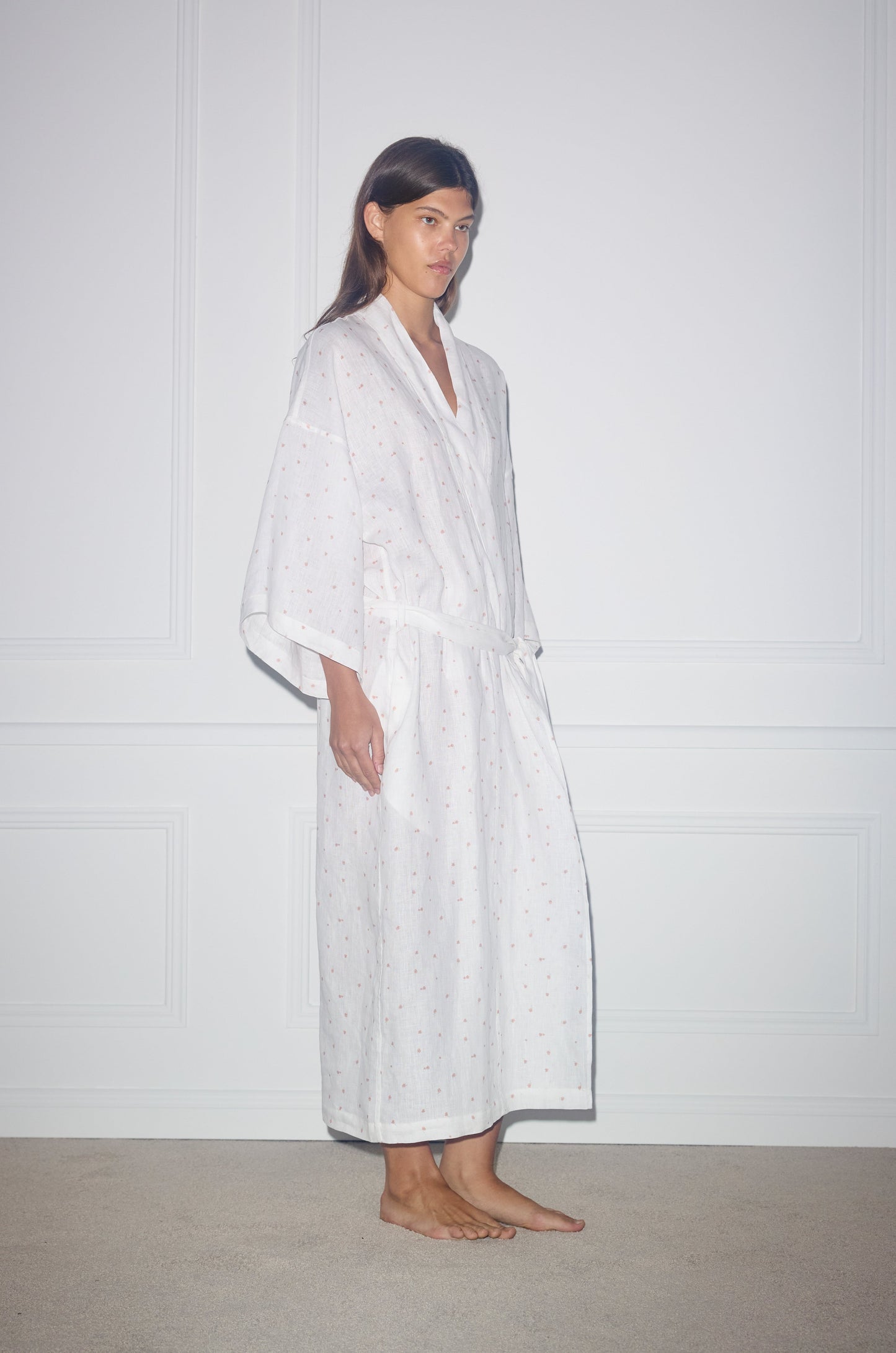 Side shot of female model wearing the 02 Robe - Corsage Print - Deiji Studios