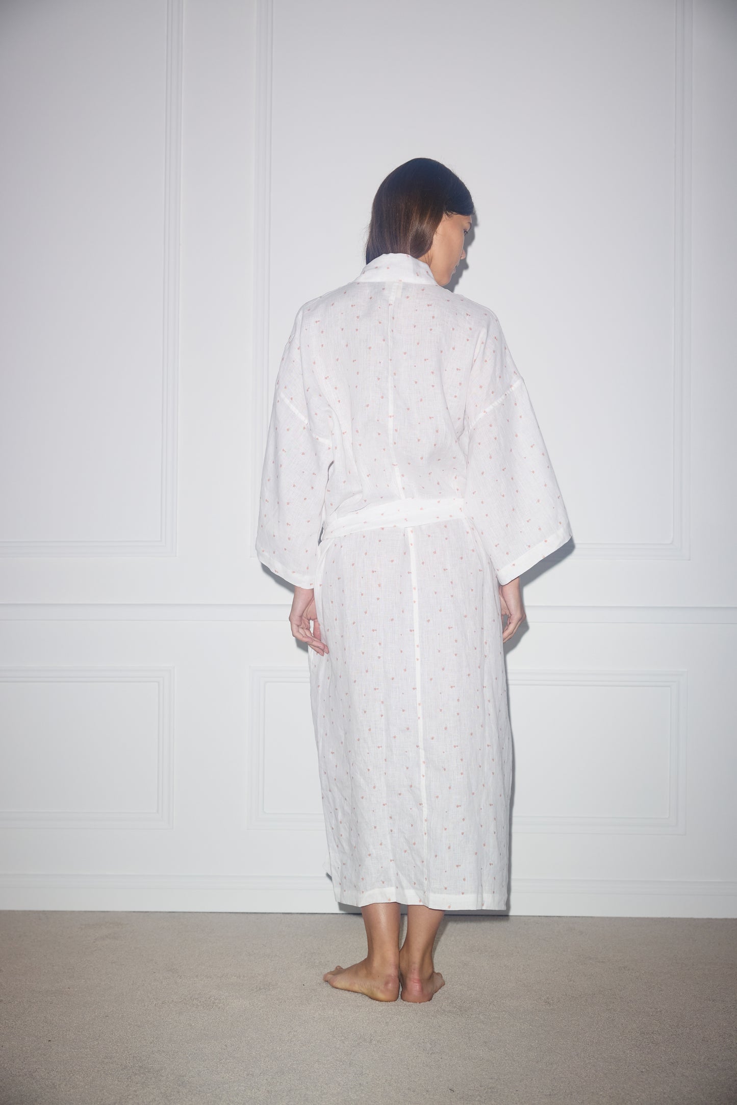 Back shot of female model wearing the 02 Robe - Corsage Print - Deiji Studios