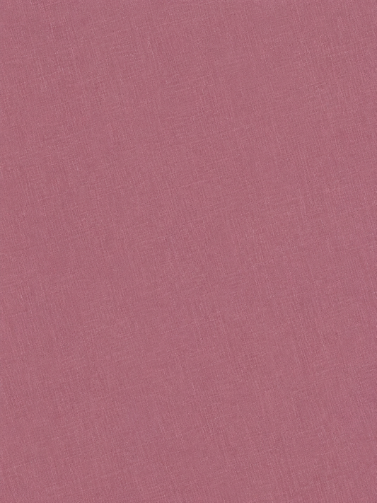 A close-up view of the Half Short - Brick showcases its textured pink fabric with fine woven lines and a subtly uneven surface—perfect for this relaxed-fit linen short featuring an elastic waistband.