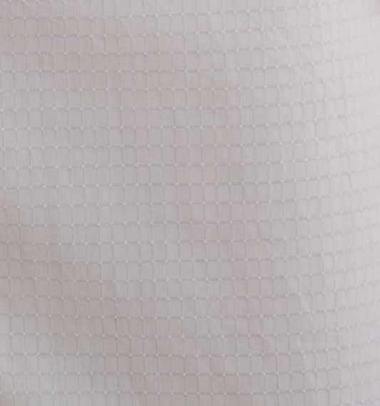 Close-up of Deiji Studios' Pocket Mini Dress - Bone Check, showcasing white organic cotton fabric with a subtle, evenly spaced square grid pattern that adds textured detail—perfect for this contemporary mini dress.