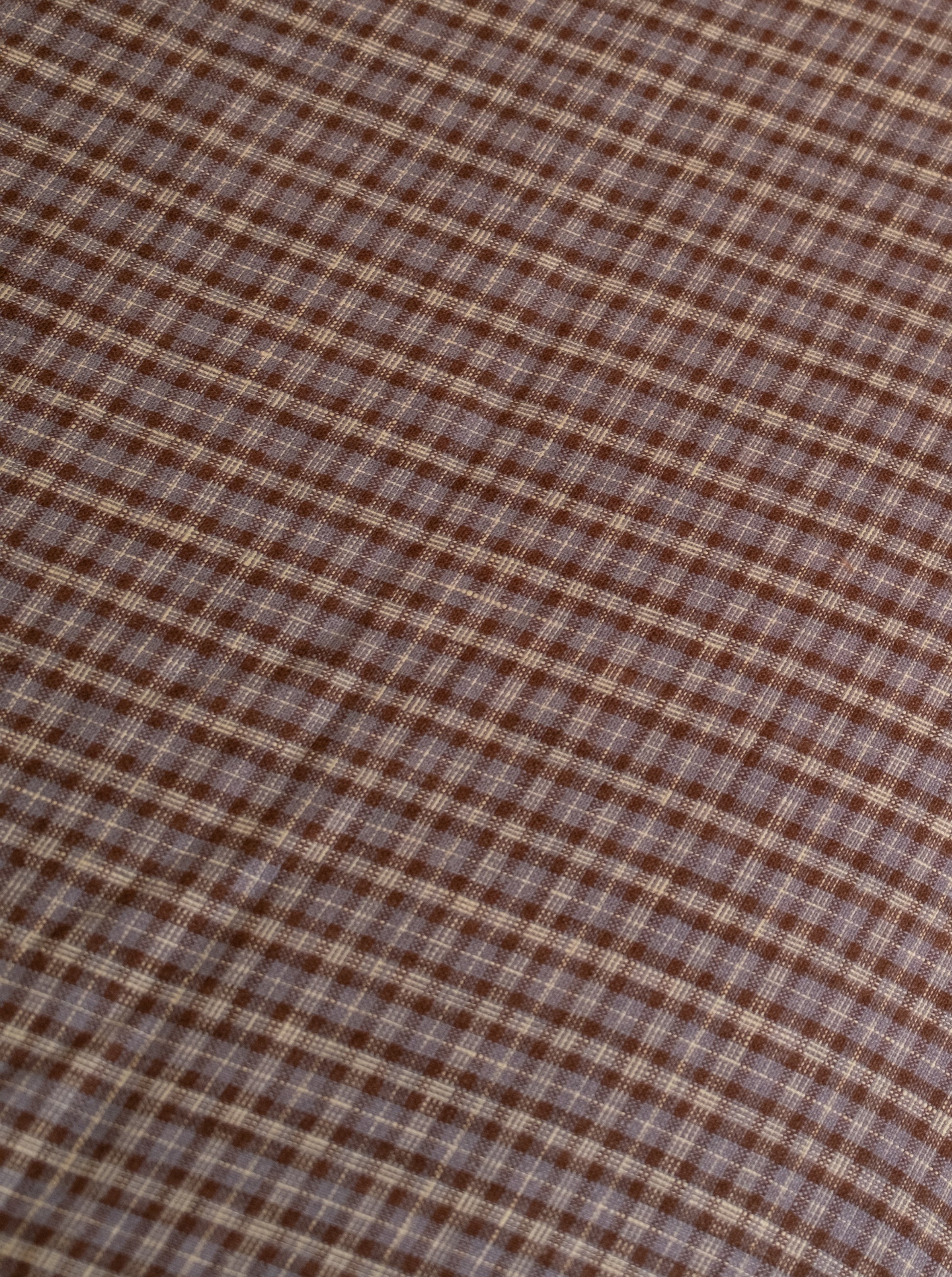 Close up of Duvet cover - russet check fabric by Deiji Studios
